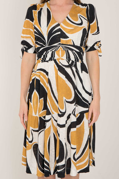 Flowy short jersey dress - Ornamental ochre flower - Mönstrad knälång trikåklänning